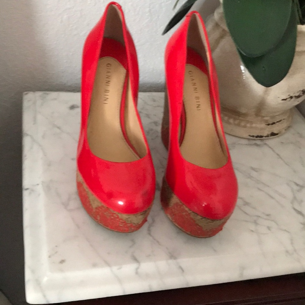 I’m selling a pair of red platform shoes.